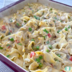 egg noodles with sauce, tuna, peas, and diced red peppers