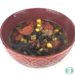 bowl of ground beef, tomatoes, corn, and black beans in broth