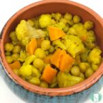 bowl of chickpeas, cauliflower florets, and other cubed vegetables