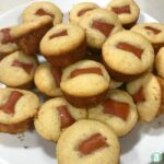 mini cornbread muffins with tiny hot dogs in each one
