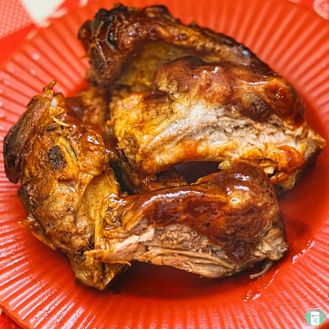 ribs on a red plate