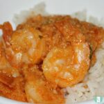 shrimp in a thick red sauce on rice