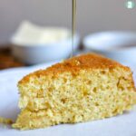 slice of cornbread with honey drizzling on top