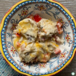 perogies, diced peppers in a cream sauce with melted cheese