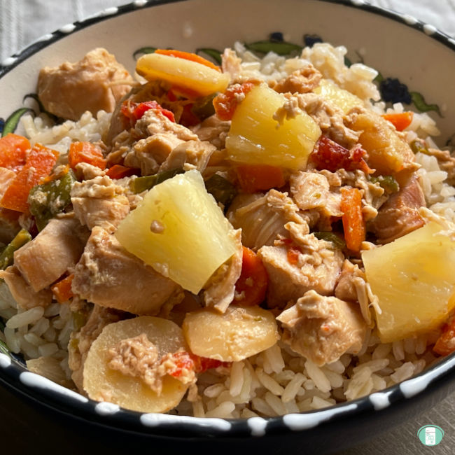 pineapple chunks, cubed chicken, carrots, dicd peppers, and water chestnuts on rice